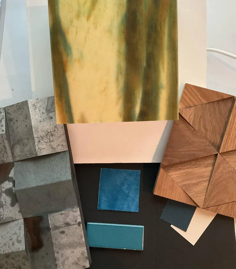 Tile, stone and wood finish samples laid out for a design selection