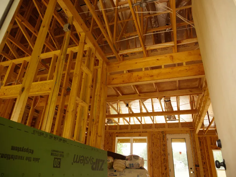 Interior framing with roof trusses and a taped ZIP System wall panel